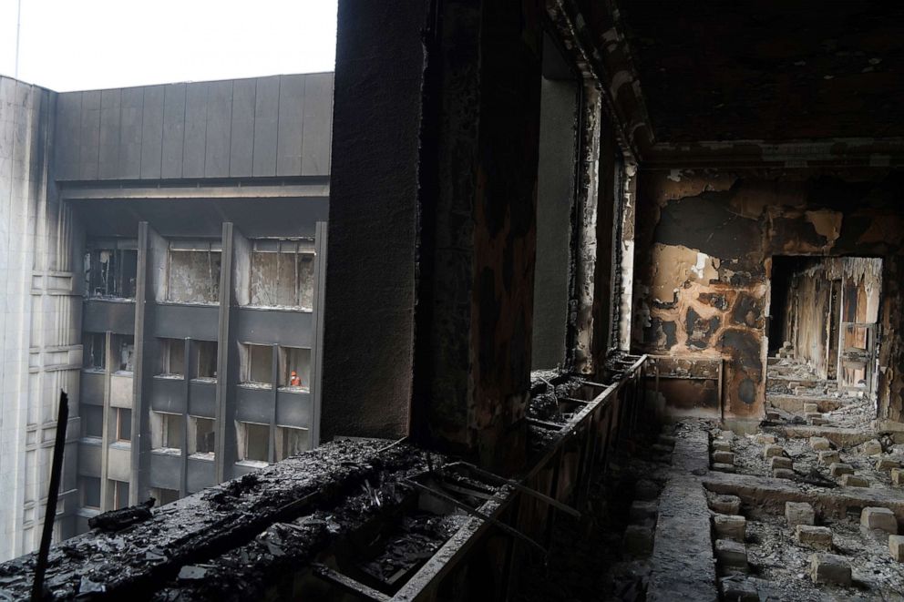 PHOTO: A municipal worker looks from a window of the burnt city hall building in Almaty, Kazakhstan, Jan. 13, 2022.