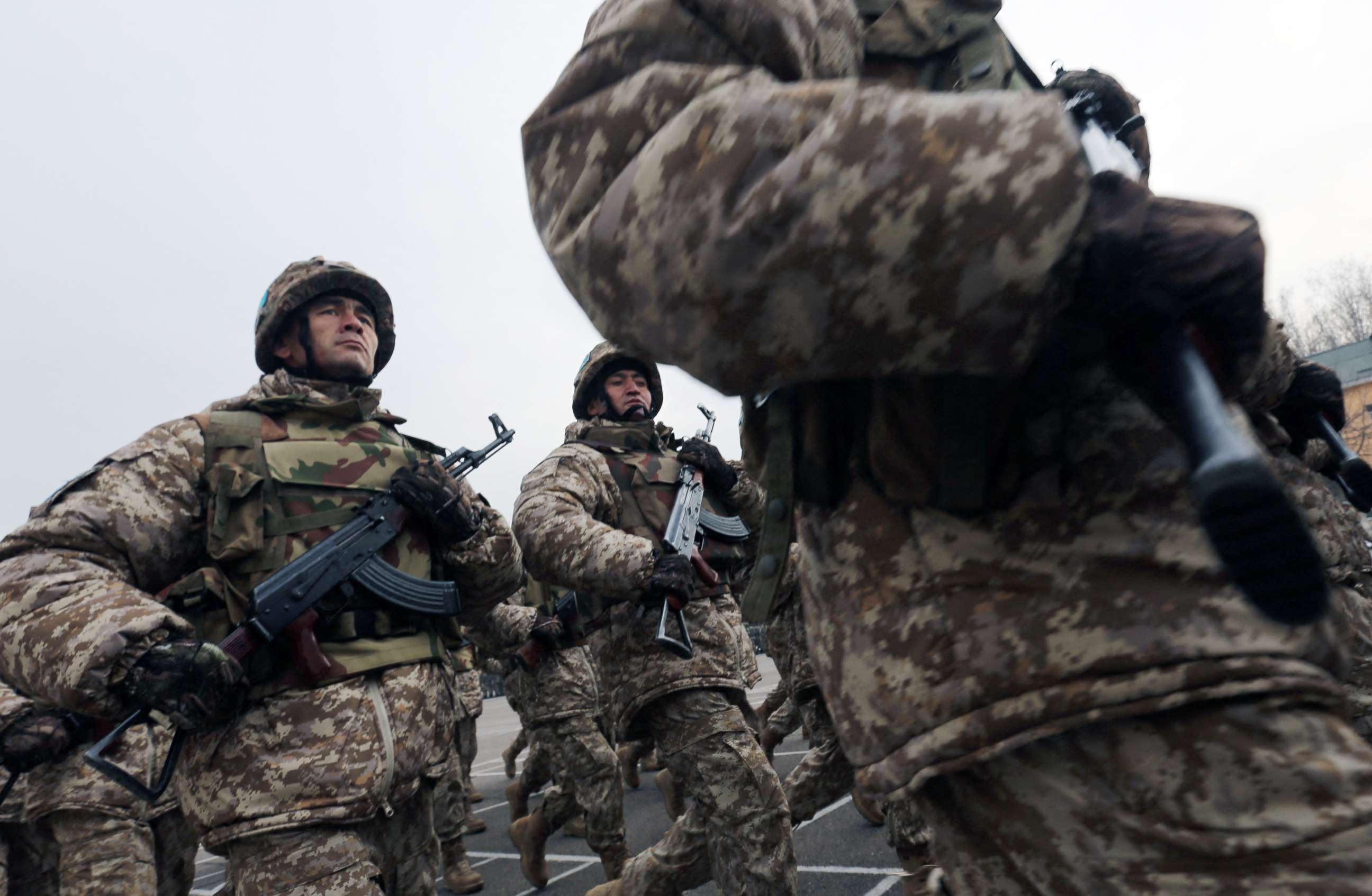 PHOTO: Tajik servicemen march during the ceremony marking the beginning of the withdrawal of peacekeeping troops of the Collective Security Treaty Organization (CSTO) from Kazakhstan, in Almaty, Kazakhstan, Jan. 13, 2022. 