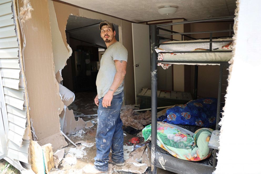 PHOTO: Dustin Elam, 31, stands in his children's former bedroom after his home was destroyed by flooding in Breathitt County Kentucky.