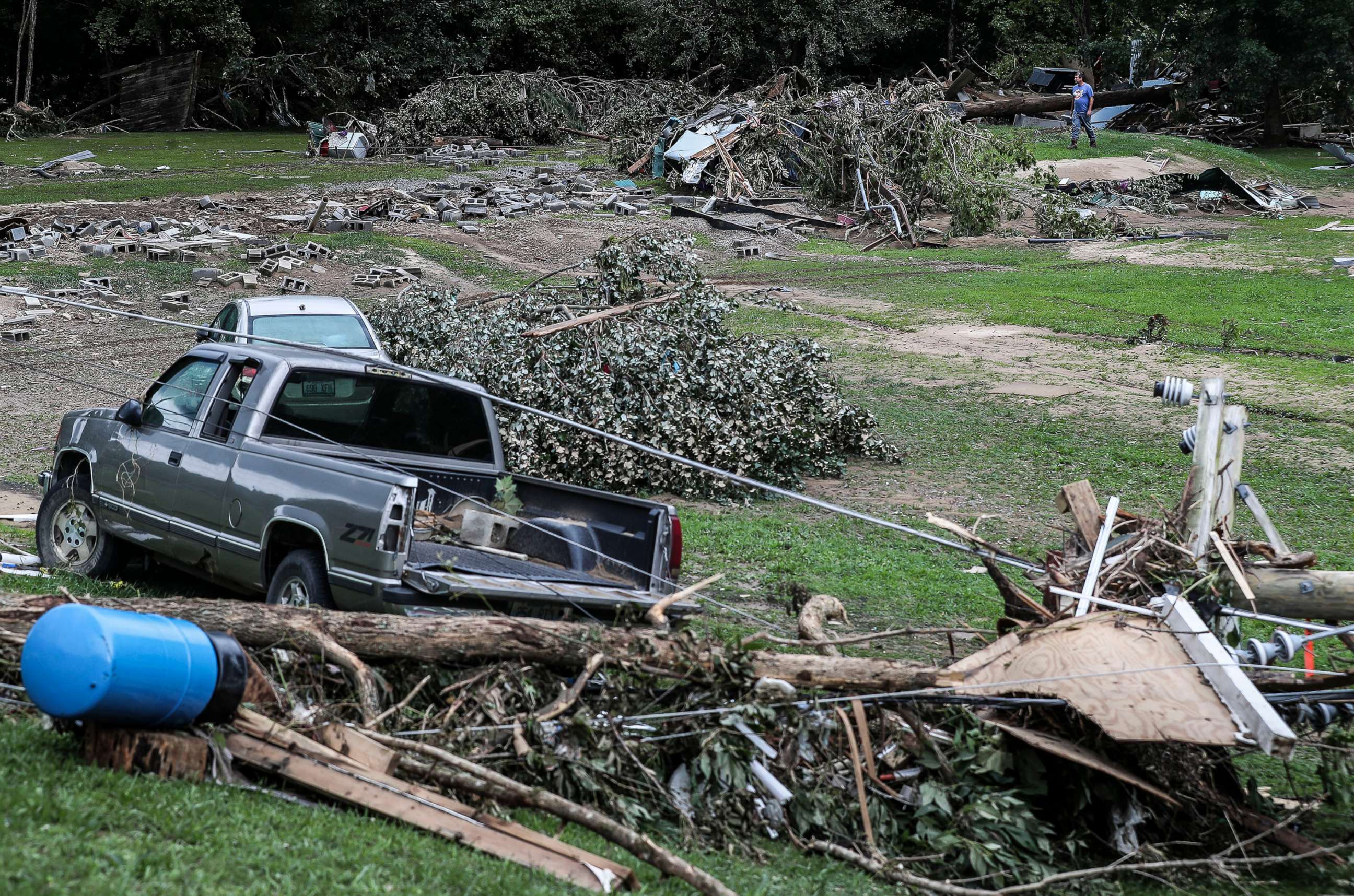 PHOTO: A man searches the remains of a trailer park that was wiped out by flood waters of Troublesome Creek in Dwarf, Ky., on July 29, 2022.
