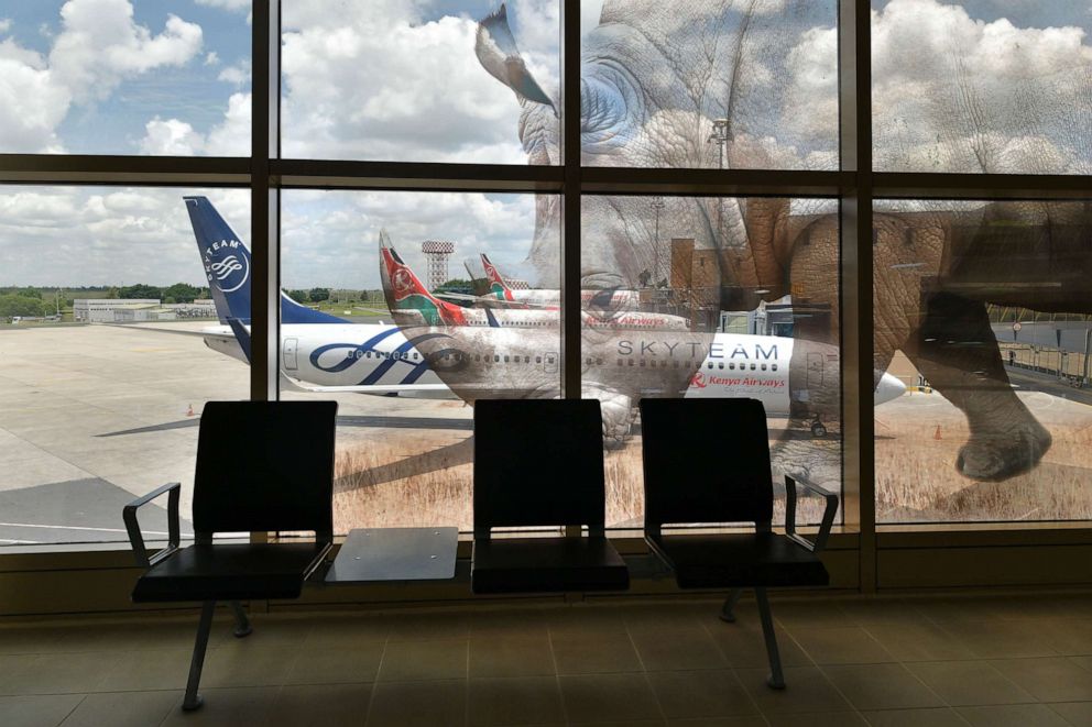 PHOTO: Grounded Kenya Airways aircraft are seen on the tarmac from the international departures lounge at the Jomo Kenyatta International Airport in Nairobi on April 3, 2020.