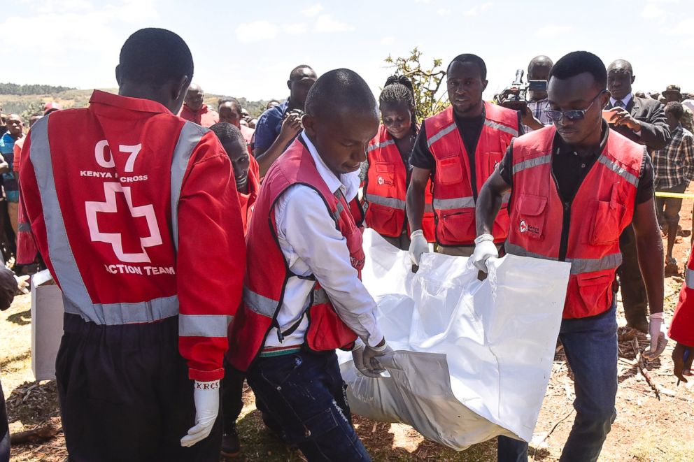 PHOTO: Members of the Kenya Red Cross carry victims' bodies after a Cessna 206 light aircraft crashed at Londiani in Kericho district, Kenya, Feb. 13, 2019.