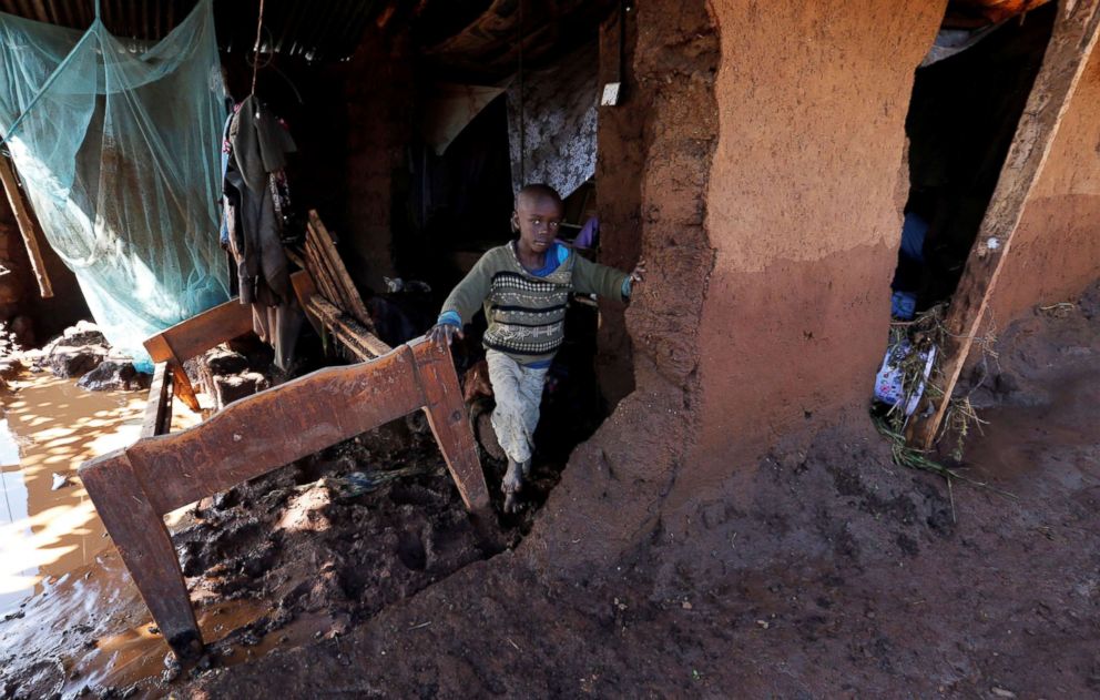 PHOTO: A child walks through his home which was partly destroyed by flood water after a dam burst, in Solio town near Nakuru, Kenya, May 10, 2018.