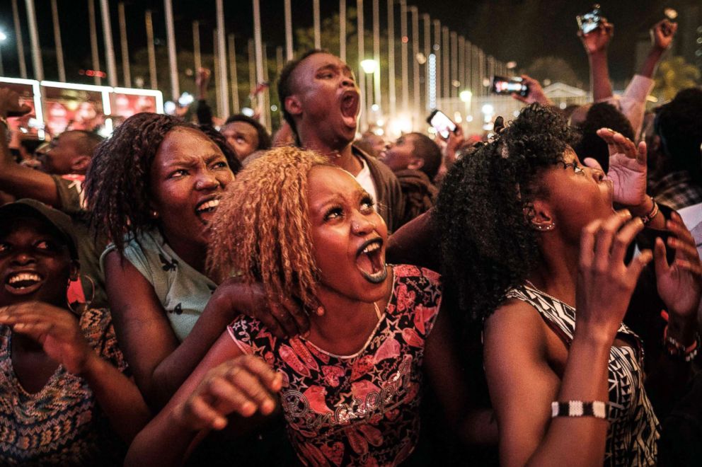 PHOTO: People react during the count down to New Year's day, Jan. 1, 2018, during the New Year's music event at Kenyatta International Convention Centre (KICC) in Nairobi, Kenya.