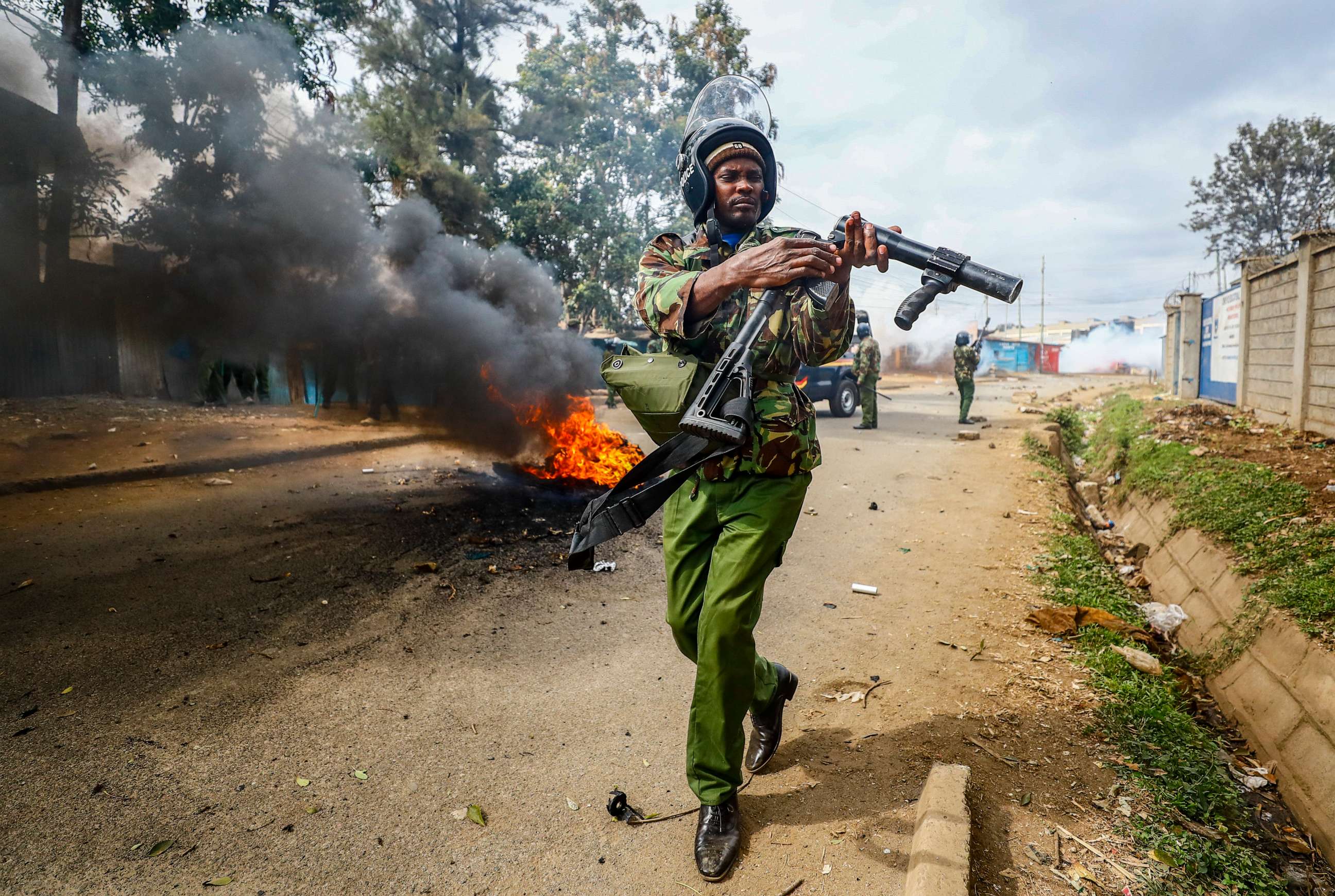 PHOTO: A riot policeman reloads a teargas grenade launcher during clashes with protesters in the Kibera area of Nairobi, Kenya, July 19, 2023.