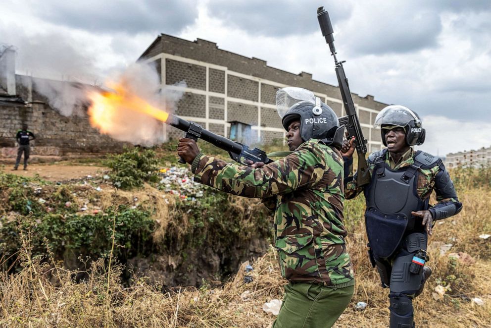 PHOTO: A Kenya Police Officer shoots a tear gas canister to disperse some protesters as they gather to demonstrate in Nairobi, Kenya, on July 12, 2023.