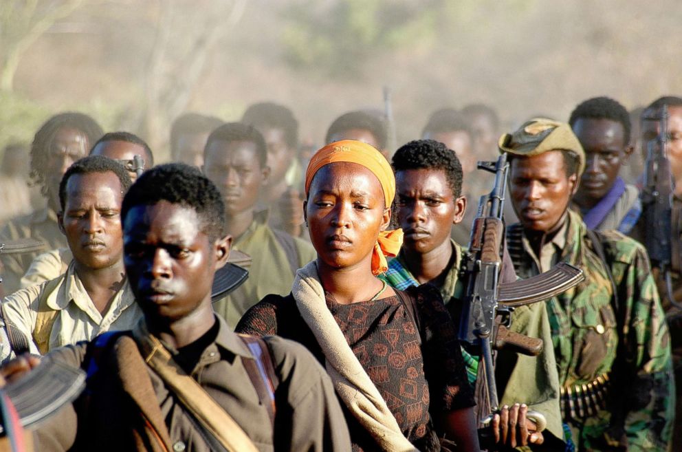 PHOTO: A female Oromo Liberation fighter is marching back to safety into Kenya with her unit.