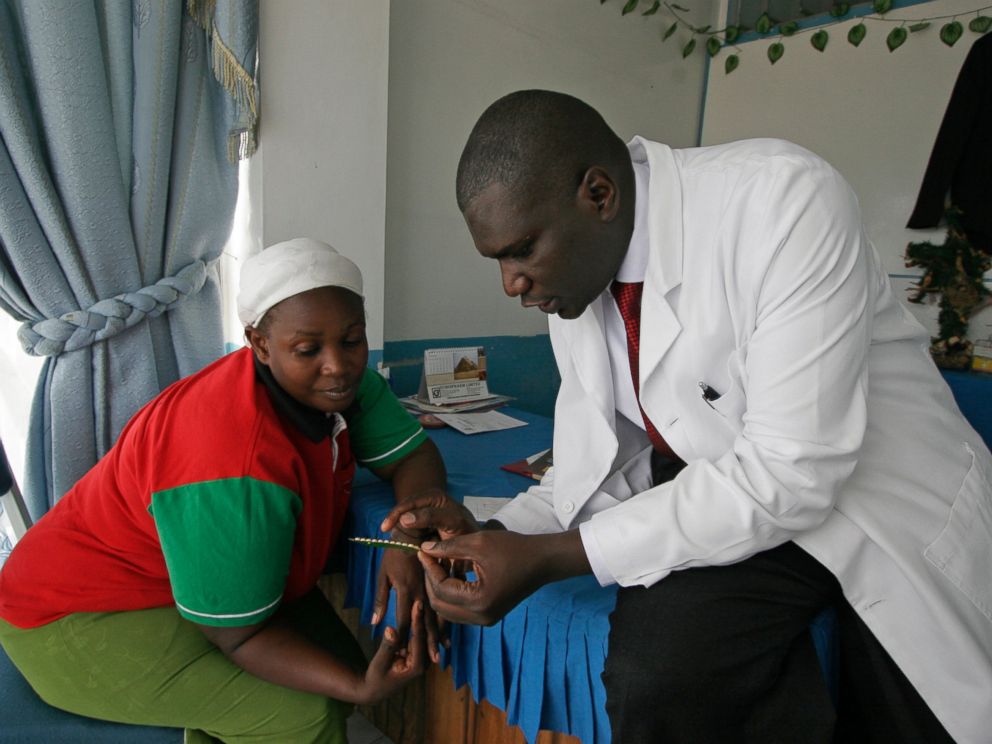 Dr. Aron Sikuku explains family planning pills to Beatrice Ravonga in Nairobi, Kenya. President Donald Trumps move a year ago to expand cuts in U.S. funding to foreign organizations providing abortion has left women without access to treatment.