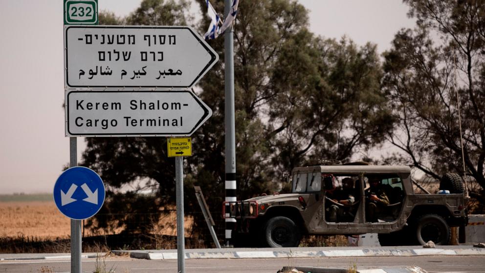 PHOTO: An Israeli army vehicle moves after Hamas fired a mortar attack on May 5, 2024 in Kerem Shalom, Israel. 