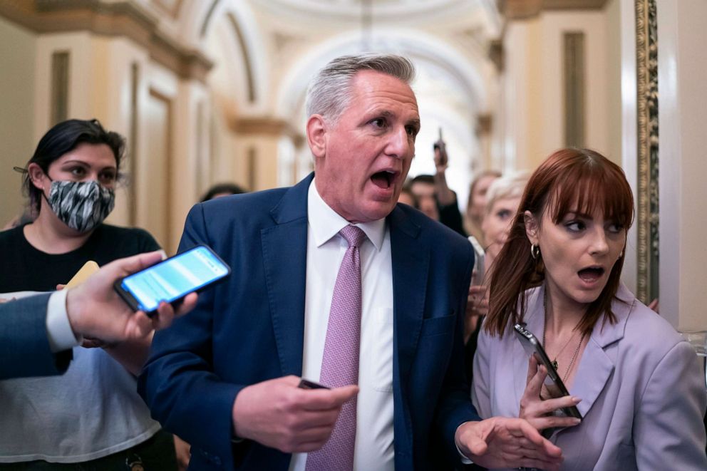 PHOTO: House Minority Leader Kevin McCarthy heads to his office surrounded by reporters at the Capitol in Washington, May 12, 2022.