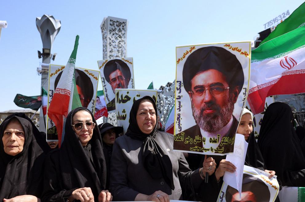PHOTO: Iranian women hold up an image of Iran's new supreme leader Ayatollah Mojtaba Khamenei as they part in a rally dubbed "Sacrificed Girls" to pay tribute to women killed during the Middle East war, in Tehran on April 17, 2026.