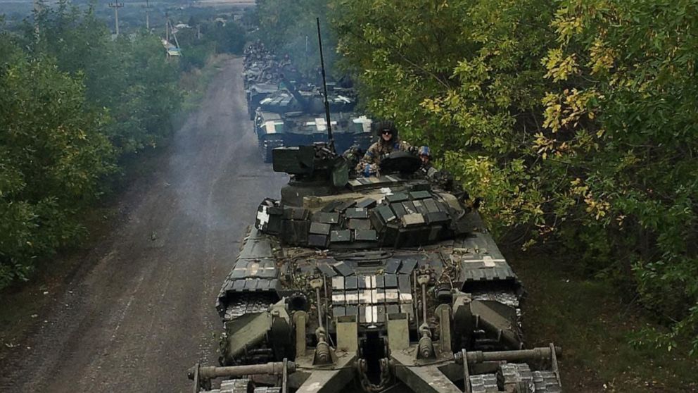 PHOTO: Ukrainian service members ride on tanks during a counteroffensive operation, amid Russia's attack on Ukraine, in Kharkiv region, Ukraine, in this handout picture released Sept. 12, 2022.