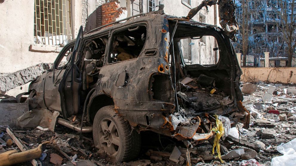 PHOTO: A car destroyed by shelling is seen in a street in Kharkiv, Ukraine, March 22, 2022.