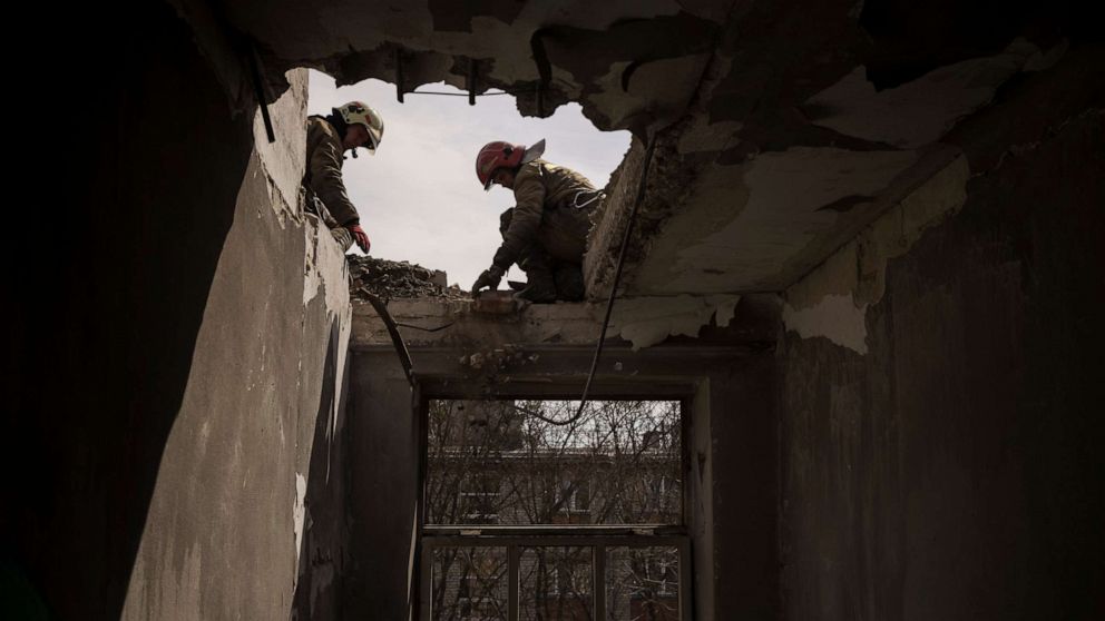PHOTO: Firefighters work to secure a building previously damaged by a Russian attack in Kharkiv, Ukraine, April 9, 2022.