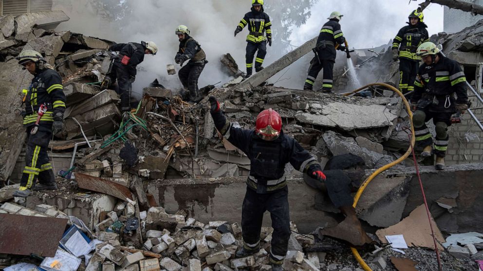 PHOTO: Rescue workers clearing rubble of a destroyed school after an attack in Kharkiv, Ukraine, on Monday, July 4, 2022.