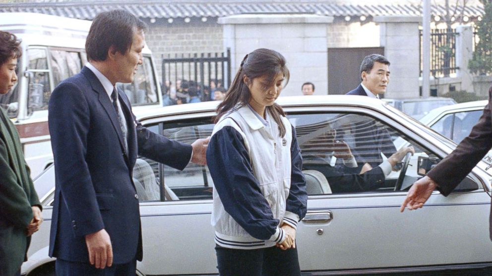 PHOTO: A security officer leads Kim Hyon-hui into the prosecutor's office in Seoul, South Korea, Dec. 2, 1988, to answer questions about the Nov. 1987 bombing of a South Korean airliner resulting in the deaths of all 115 persons on board. 