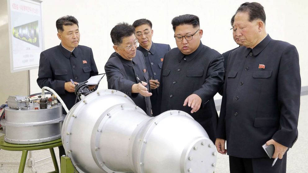 PHOTO: This undated picture released by North Korea's official Korean Central News Agency (KCNA) on Sept. 3, 2017 shows North Korean leader Kim Jong-Un (C) looking at a metal casing with two bulges at an undisclosed location.
