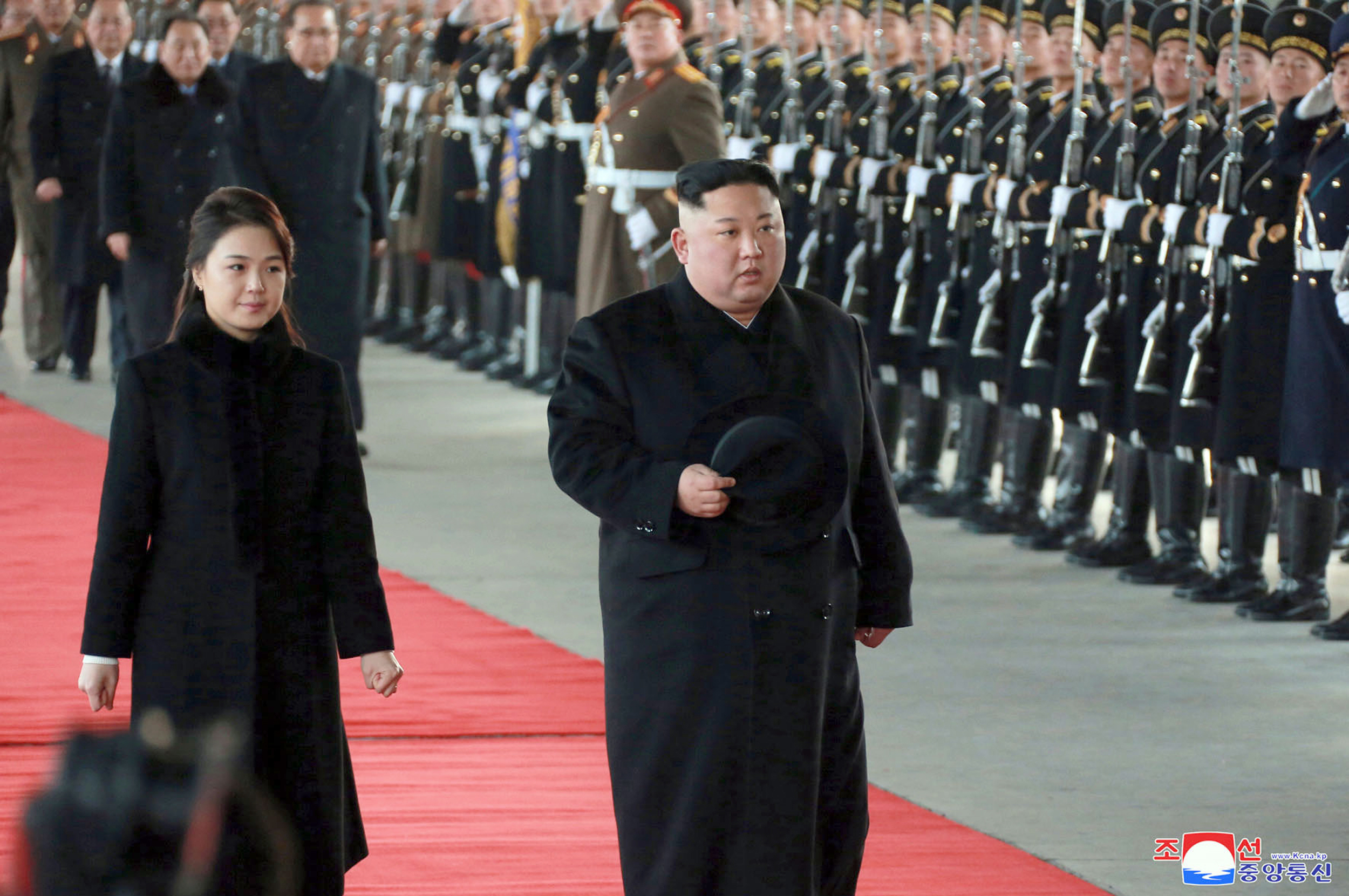 PHOTO: North Korean leader Kim Jong Un walks with his wife Ri Sol Ju at Pyongyang Station in Pyongyang, North Korea, before leaving for China, Jan. 7, 2019.
