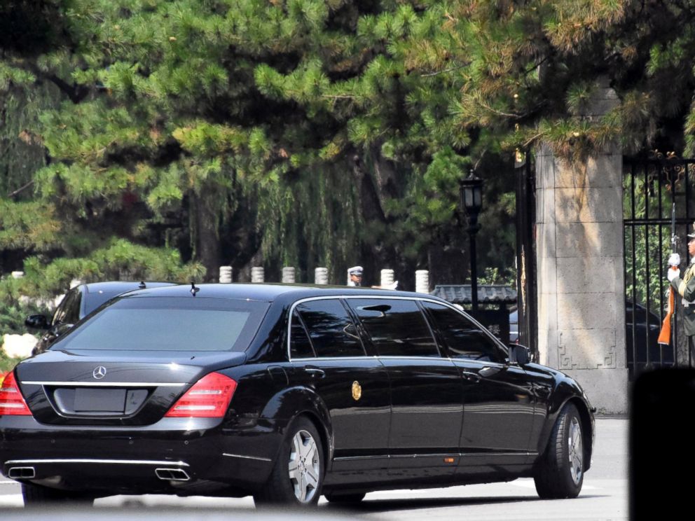 A stretch limousine with a golden emblem similar to one North Korean leader Kim Jong Un has used previously, arrives with motorcycle escorts and guard of honor salute at the Diaoyutai State Guest house in Beijing, China, Tuesday, June 19, 2018.