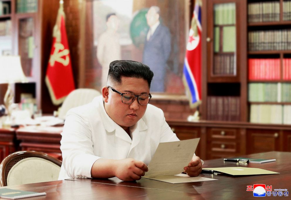 PHOTO: This file undated and unlocated picture released from North Korea's official Korean Central News Agency on June 23, 2019, shows North Korean leader Kim Jong Un reading a personal letter from U.S. President Donald Trump.