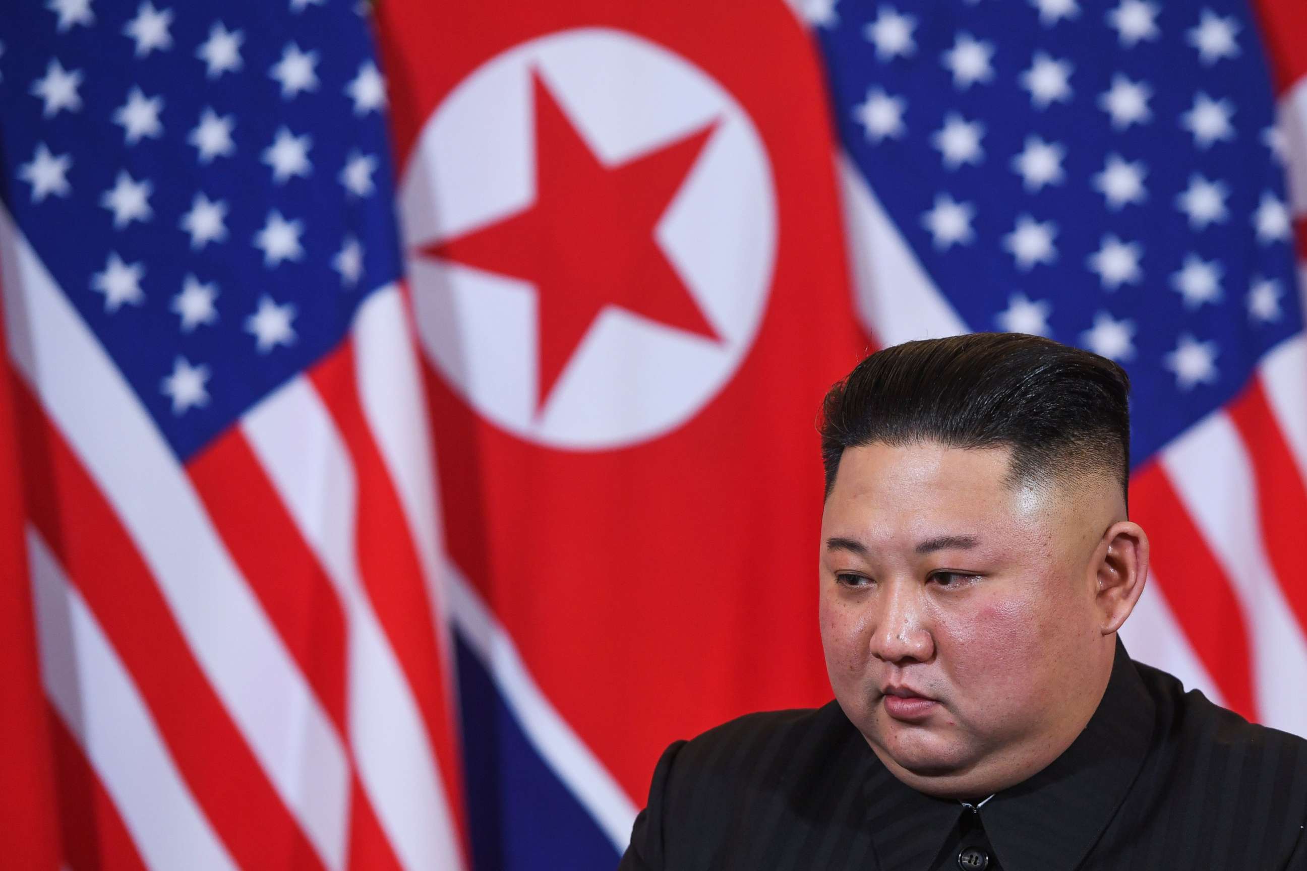 PHOTO: North Korea's leader Kim Jong Un listens to President Donald Trump during a meeting at the Sofitel Legend Metropole hotel in Hanoi, Feb. 27, 2019.