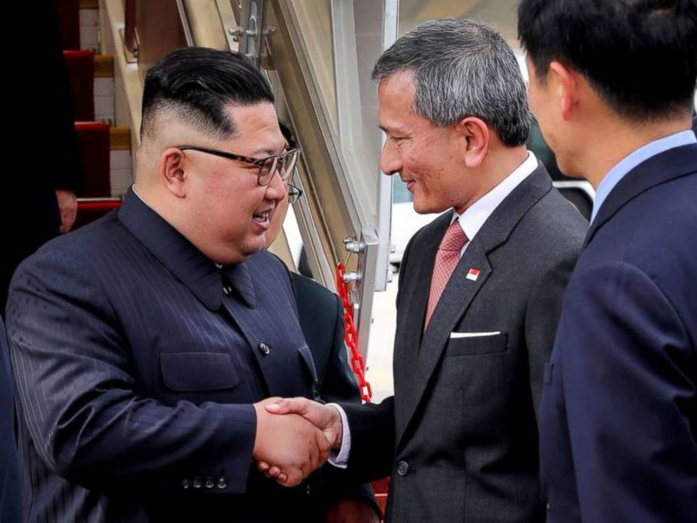 Kim Jong Un is greeted by Singapores minister for foreign affairs, Vivian Balakrishnan, upon landing in the city-state on Sunday, June 10, 2018.