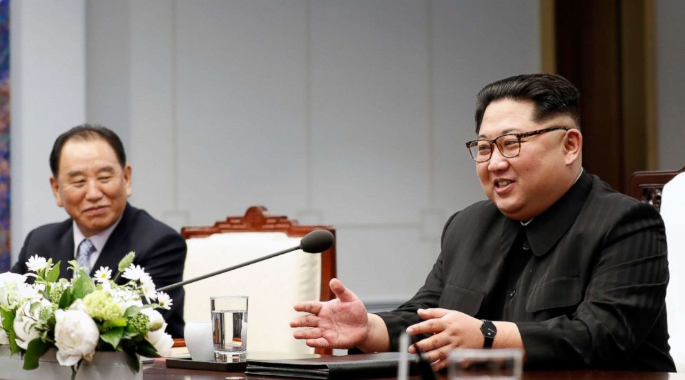 PHOTO: North Korea's leader Kim Jong Un (R) speaks with South Korea's President Moon Jae-in (unseen) as North Korean General Kim Yong Chol (L) looks on during the inter-Korean summit in the Peace House building in Panmunjom, April 27, 2018.