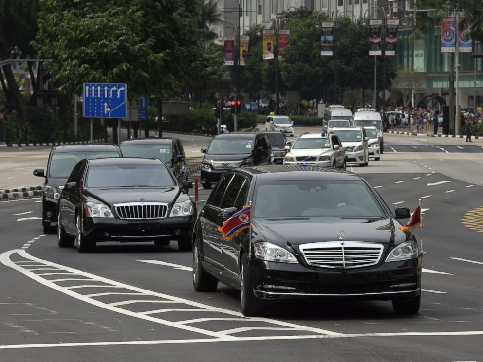 The North Korean motorcade, believed to be carrying North Korean leader Kim Jong Un, travels along Singapores Orchard Road, Sunday, June 10, 2018, ahead of the summit with U.S. leader Donald Trump.