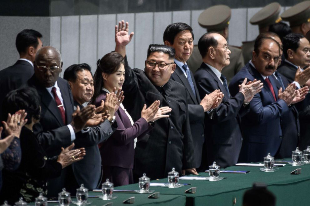 PHOTO: North Korea's leader Kim Jong Un (C) waves as he stands beside China's Chairman of the Standing Committee of the National People's Congress Li Zhanshu (center R) during the Arirang Mass Games in Pyongyang, Sept. 9, 2018.