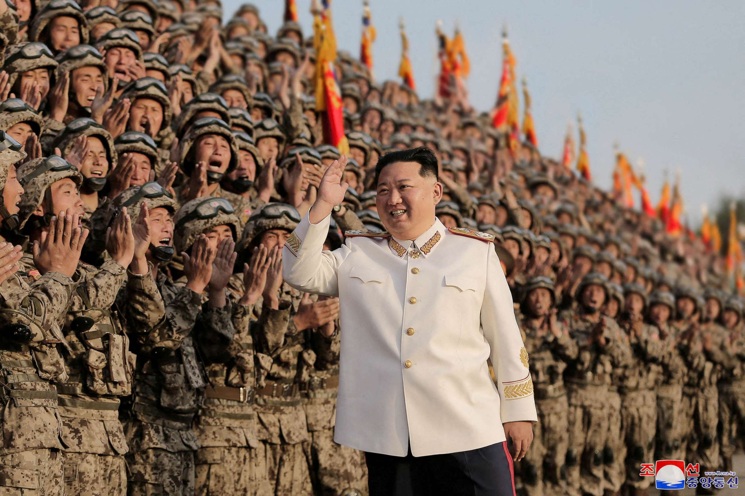 PHOTO: North Korean leader Kim Jong Un meets troops who have taken part in a military parade to mark the 90th anniversary of the founding of the Korean People's Revolutionary Army.