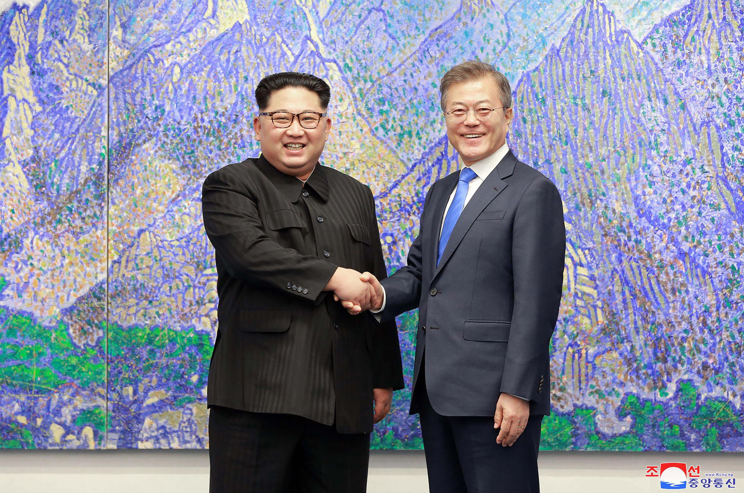 PHOTO: North Korea's leader Kim Jong Un (L) is pictured shaking hands with South Korea's President Moon Jae-in (R) during the Inter-Korean summit in the Peace House building on the southern side of the truce village of Panmunjom, April 27, 2018.