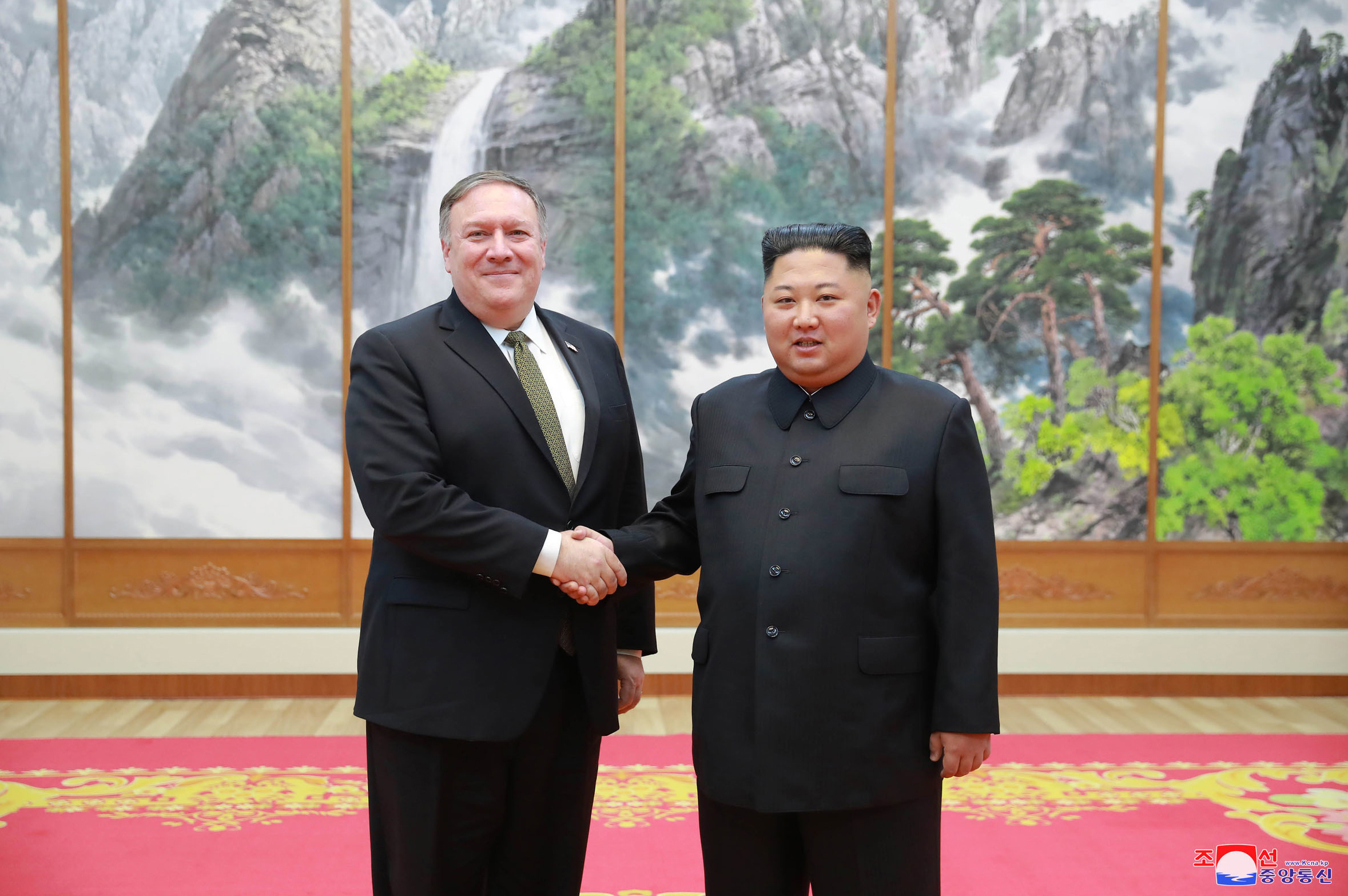 PHOTO: In this photo provided by the North Korean government, Secretary of State Mike Pompeo, left, shakes hands with North Korean leader Kim Jong Un as they pose for a photo in Pyongyang, North Korea, Oct. 7, 2018.