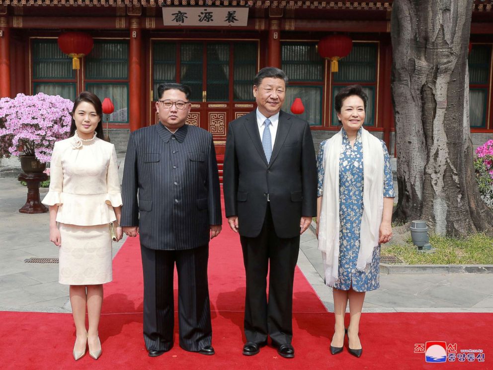 PHOTO: North Korean leader Kim Jong Un and wife Ri Sol Ju, and Chinese President Xi Jinping and wife Peng Liyuan pose for a photo in Beijing, China in this undated photo released by North Koreas Korean Central News Agency in Pyongyang March 28, 2018