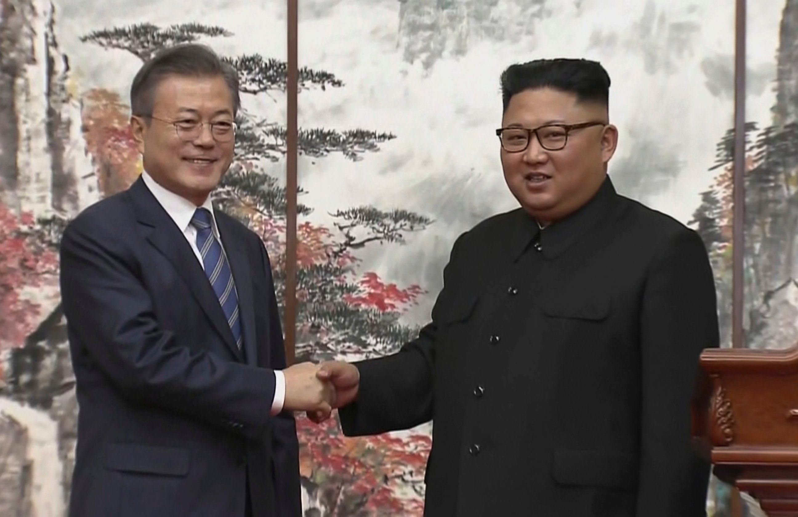 In this image made from video provided by Korea Broadcasting System, North Korean leader Kim Jong Un, right, and South Korean President Moon Jae-in shake hands at the end of their press conference in Pyongyang, North Korea, Sept. 19, 2018.