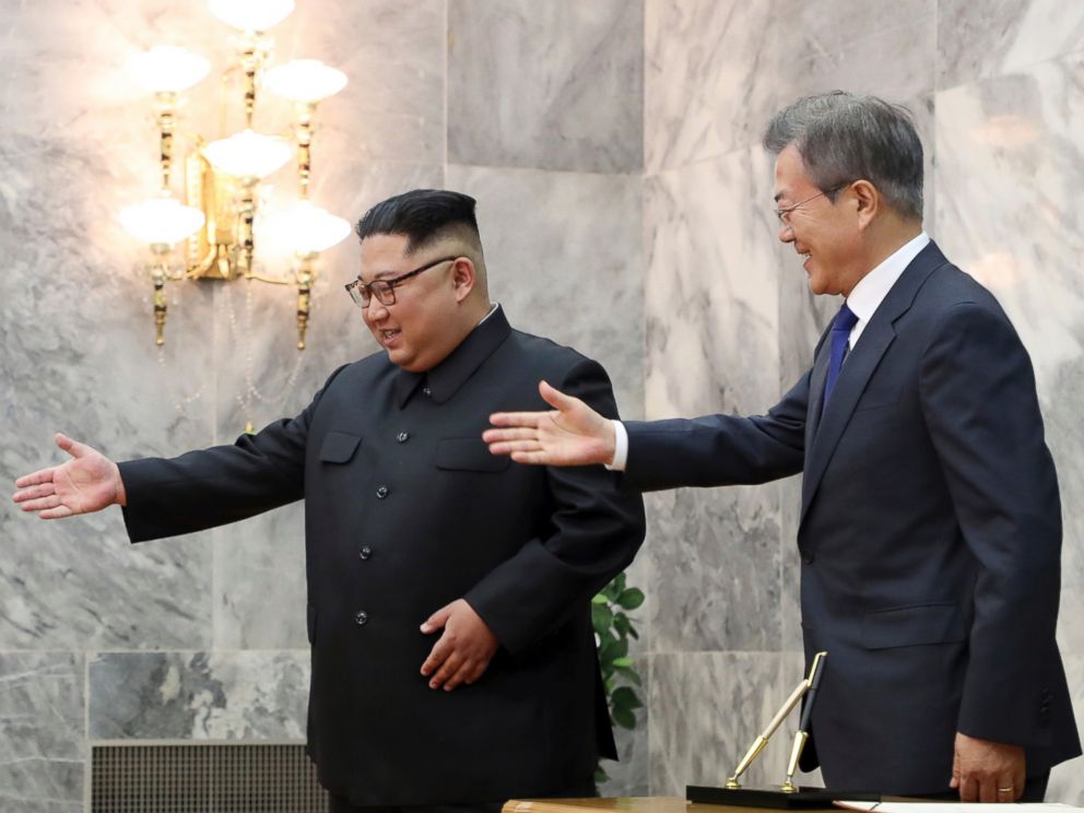 In this May 26, 2018 photo provided by South Korea Presidential Blue House via Yonhap News Agency, South Korean President Moon Jae-in, right, is guided by North Korean leader Kim Jong Un, left, at the northern side of Panmunjom in North Korea.