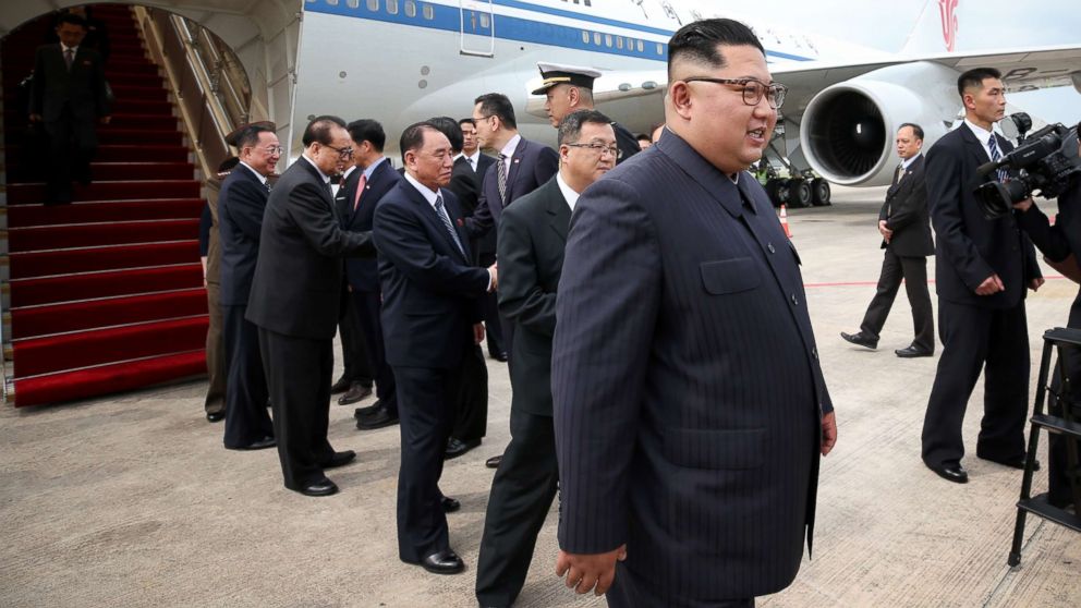 Kim Jong Un, right, arrives in Singapore for North Korea's summit with U.S. President Donald Trump on Sunday, June 10, 2018.