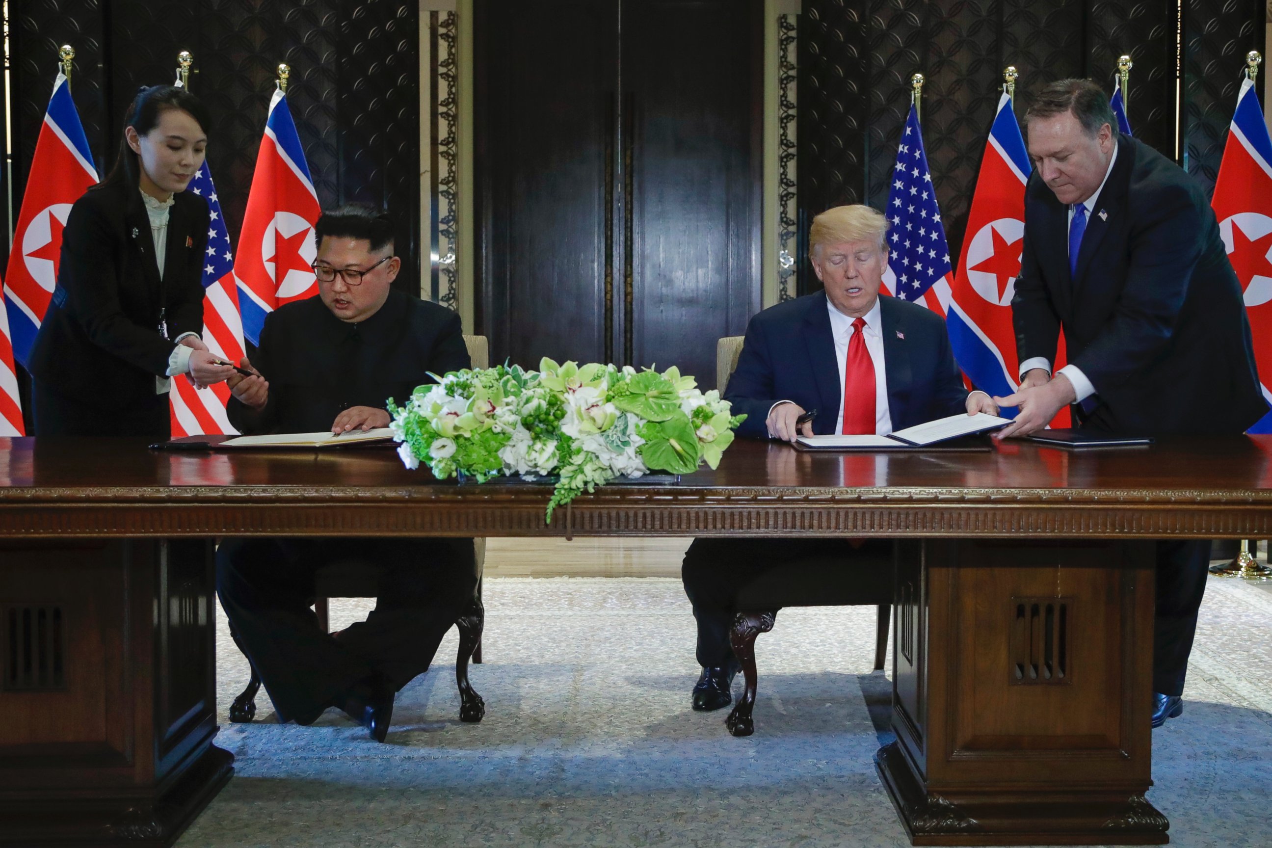 PHOTO: Kim Jong Un’s sister, Kim Yo Jong, far left, provided a pen of her own for his use at the June 12, 2018 summit between Kim Jong Un and U.S. President Donald Trump.