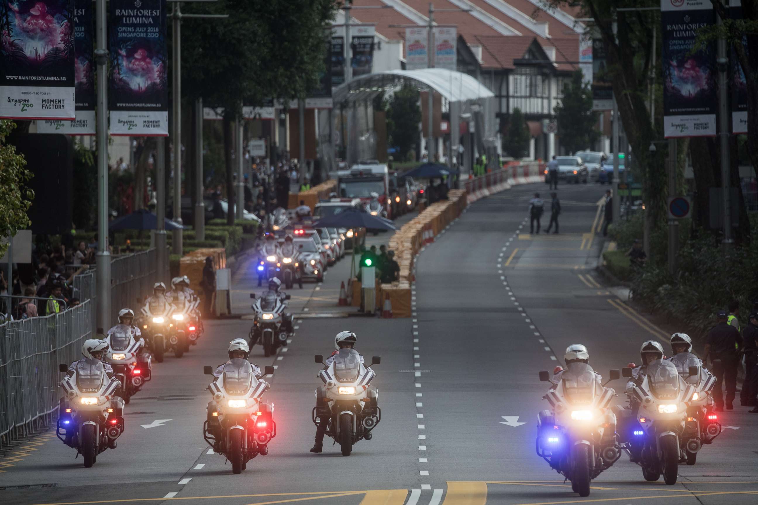 PHOTO: Police clear Singapore's famous Orchard Road ahead of the motorcade of North Korean leader Kim Jong-un departing the St Regis hotel for a meeting with  Singapore's Prime Minister Lee Hsien Loong, June 10, 2018 in Singapore. 