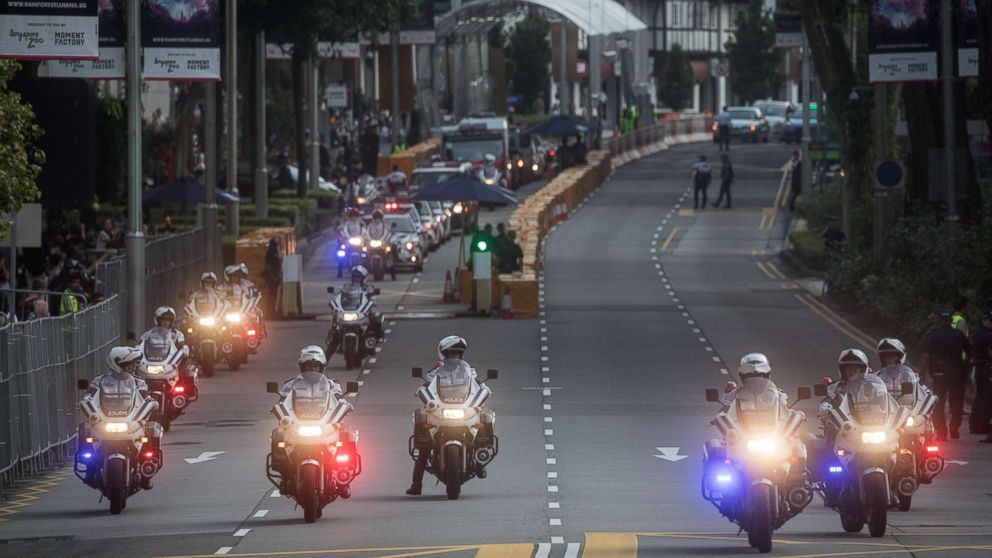 Police clear Singapore's famous Orchard Road ahead of the motorcade of North Korean leader Kim Jong-un departing the St Regis hotel for a meeting with Singapore's Prime Minister Lee Hsien Loong, June 10, 2018 in Singapore.