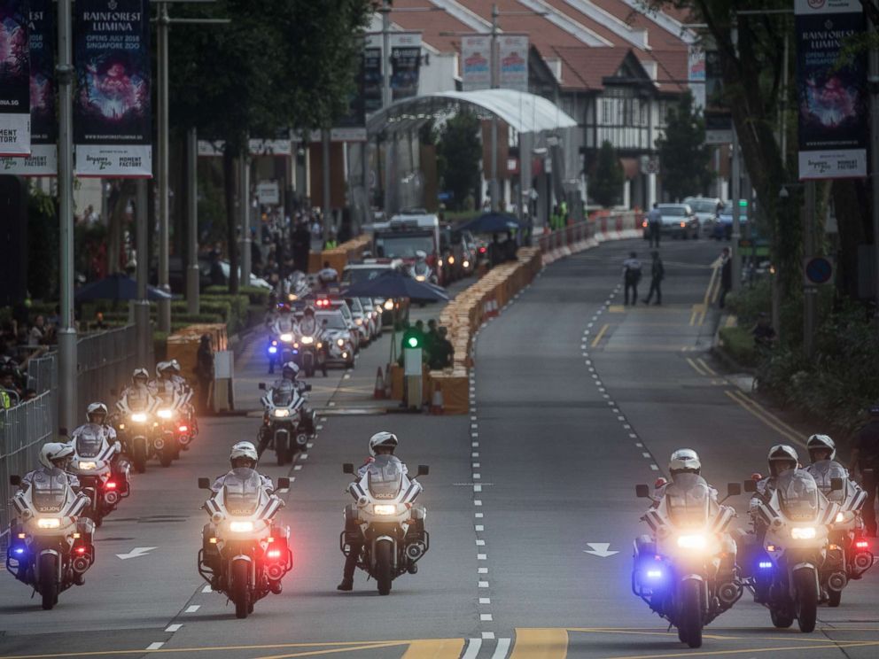 PHOTO: Police clear Singapores famous Orchard Road ahead of the motorcade of North Korean leader Kim Jong-un departing the St Regis hotel for a meeting with Singapores Prime Minister Lee Hsien Loong, June 10, 2018 in Singapore.