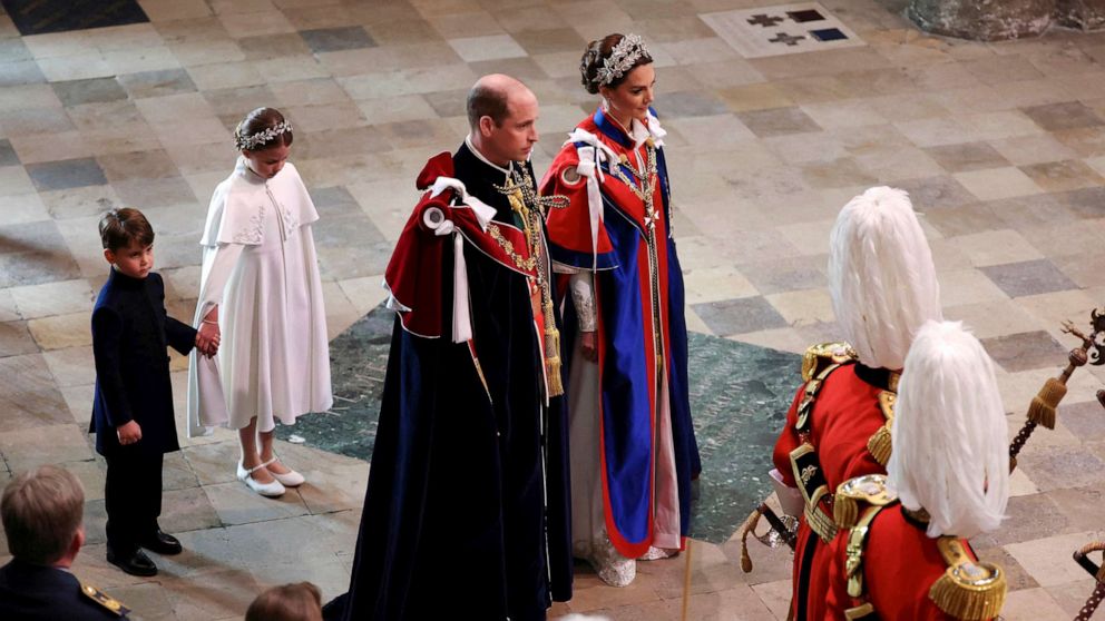 PHOTO: Britain's Prince William and Kate, Princess of Wales, followed by Princess Charlotte and Prince Louis, arrive for the coronation of King Charles III at Westminster Abbey, London, May 6, 2023.
