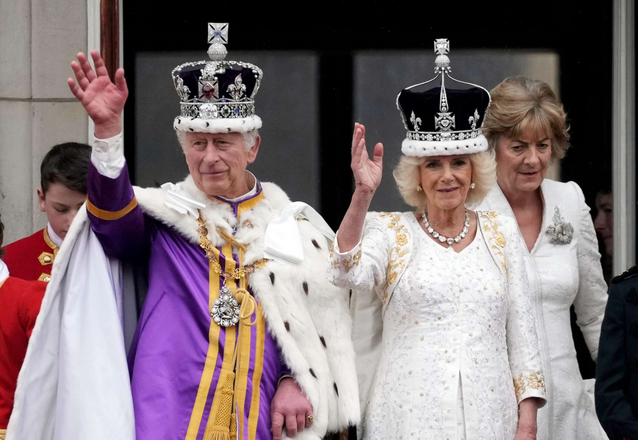 PHOTO: King Charles III and Queen Camilla can be seen on the Buckingham Palace balcony ahead of the flypast during the Coronation of King Charles III and Queen Camilla, May 06, 2023 in London.