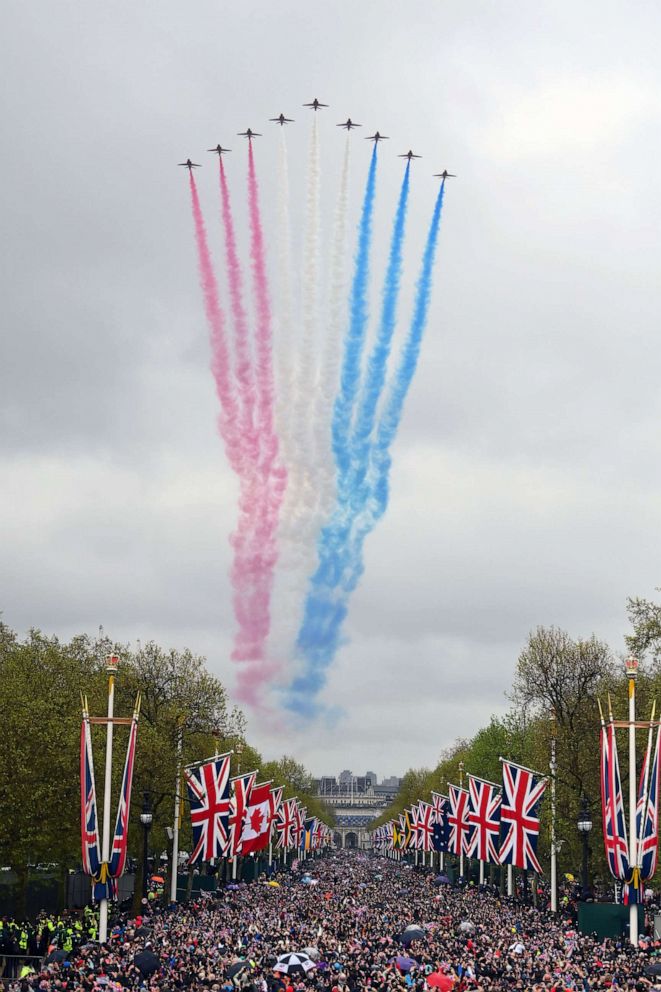 PHOTO: The Royal Air Force Aerobatic Team otherwise known as The Red Arrows fly over The Queen Victoria Memorial during the Coronation of King Charles III and Queen Camilla, May 06, 2023 in London.