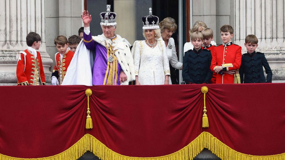 PHOTO: Britain's King Charles and Queen Camilla stand on the Buckingham Palace balcony following their coronation ceremony in London, Britain May 6, 2023.