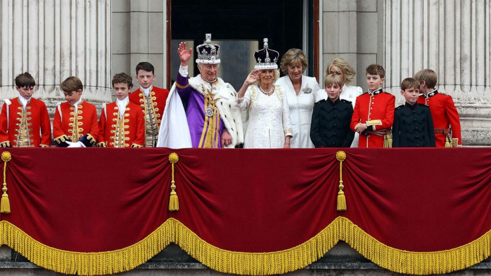 PHOTO: Britain's King Charles and Queen Camilla stand on the Buckingham Palace balcony following their coronation ceremony in London, Britain May 6, 2023.