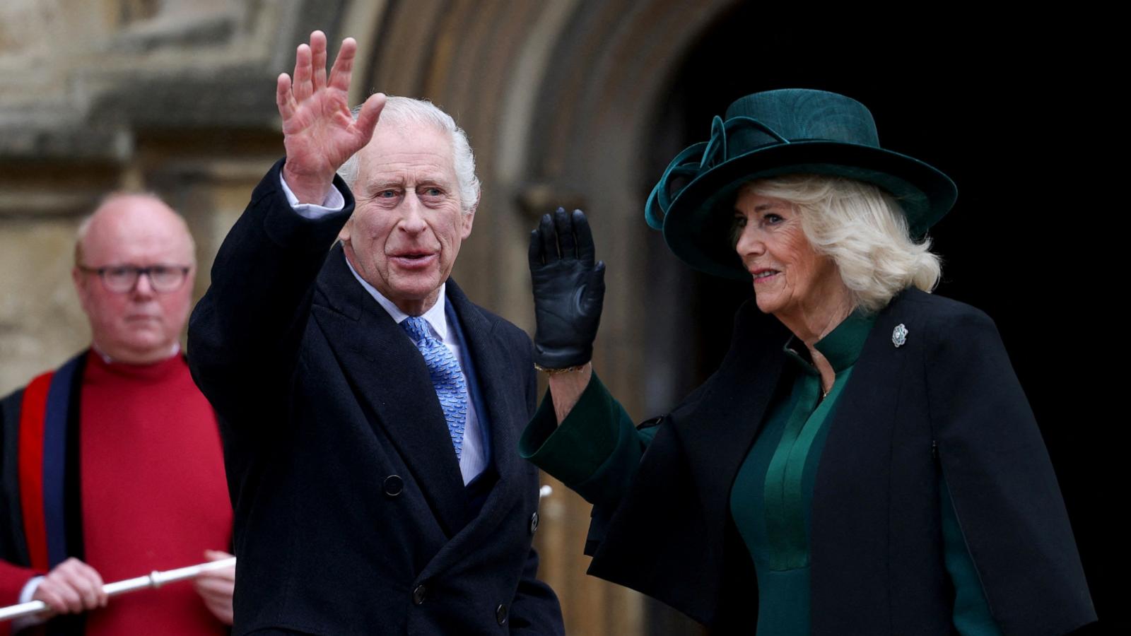 PHOTO: Britain's King Charles III and Britain's Queen Camilla wave as they arrive at St. George's Chapel, Windsor Castle, to attend the Easter Mattins Service, on March 31, 2024.