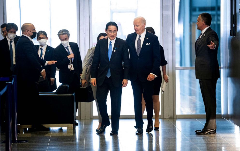 PHOTO: In this March 24, 2022, file photo, President Joe Biden speaks with Japanese Prime Minister Fumio Kishida as they walk from a meeting to the G7 family photo at NATO Headquarters in Brussels.