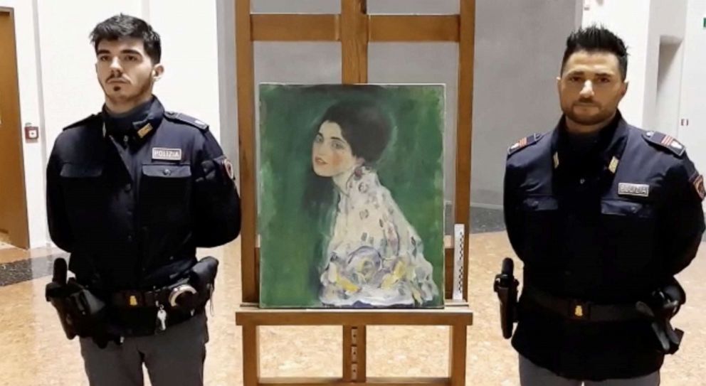 PHOTO: Italian police stand next to what they say is "Portrait of a Lady" by Austrian artist Gustav Klimt that was stolen in 1997 and was found hidden in an outside wall of an Italian gallery, in Piazcenza, Italy Dec. 10, 2019.