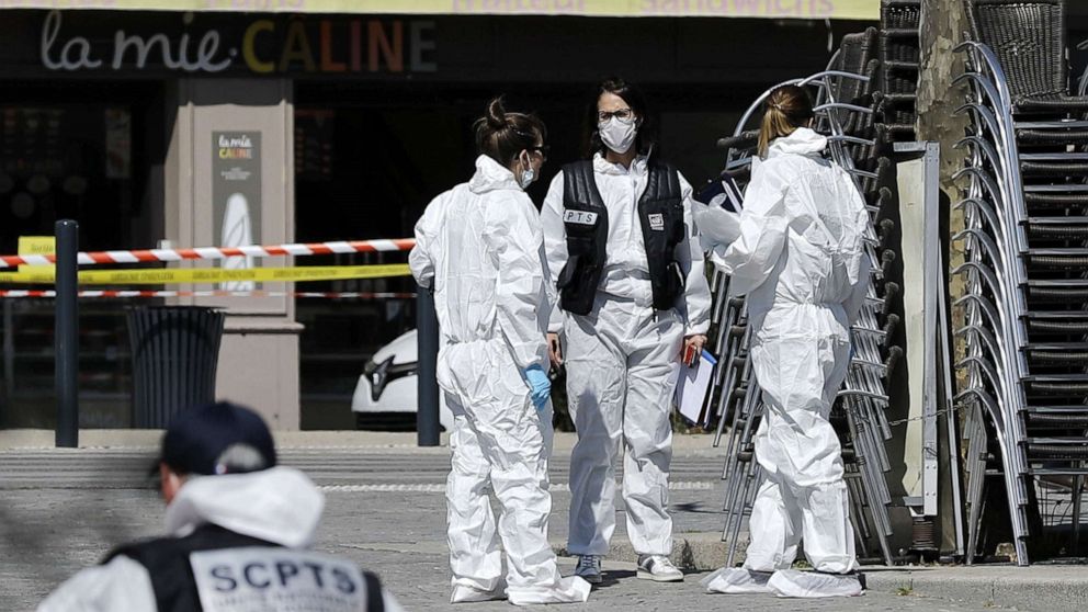 PHOTO: Police officers and investigators work on the scene of attack after a man stabbed several people in Romans-sur-Isere, France, April 4, 2020.