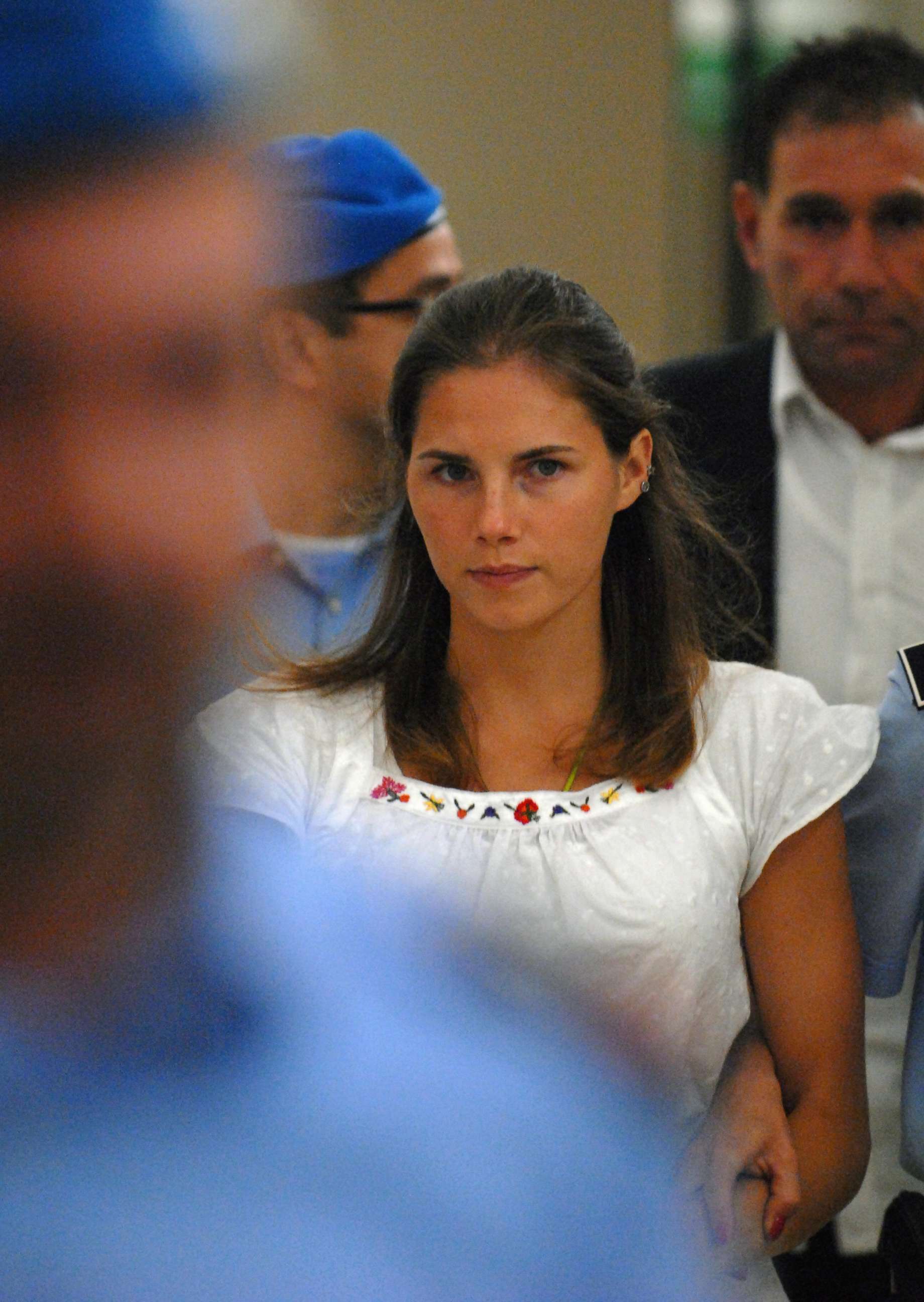 PHOTO: One of the three suspects in the murder of British student Meredith Kercher, Amanda Knox, is escorted by police upon her arrival at a court hearing in Perugia, Italy, Sept. 16, 2008. 